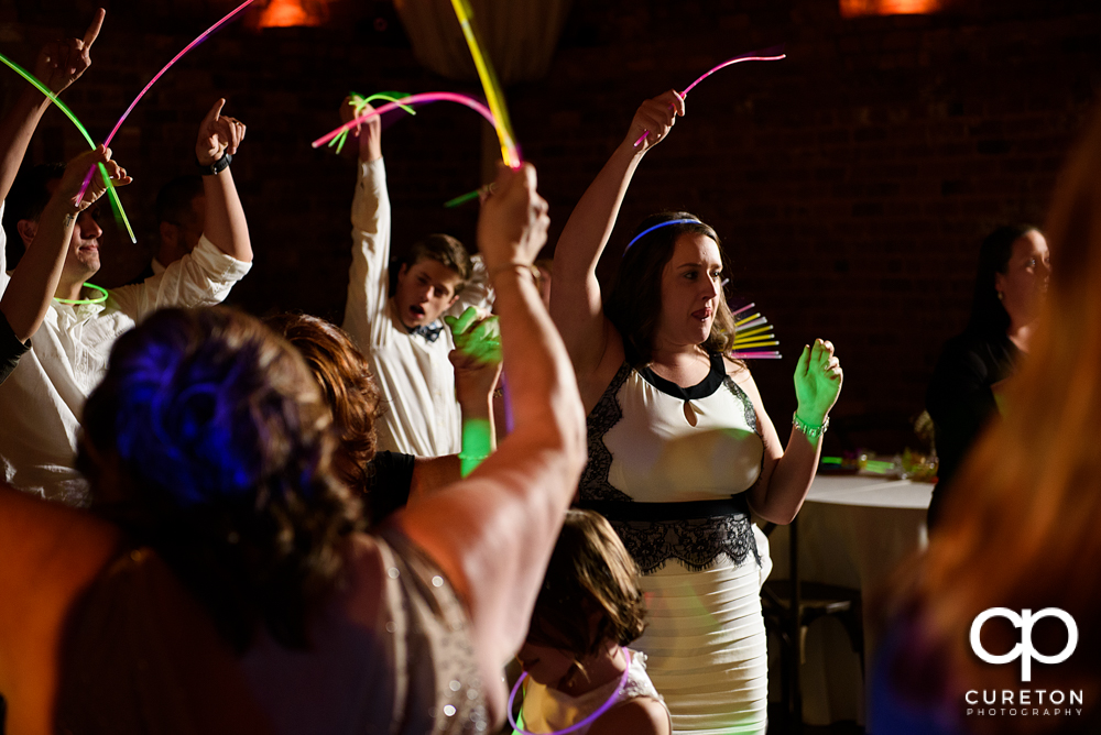 Wedding guests dancing to the sounds of Uptown Entertainment.