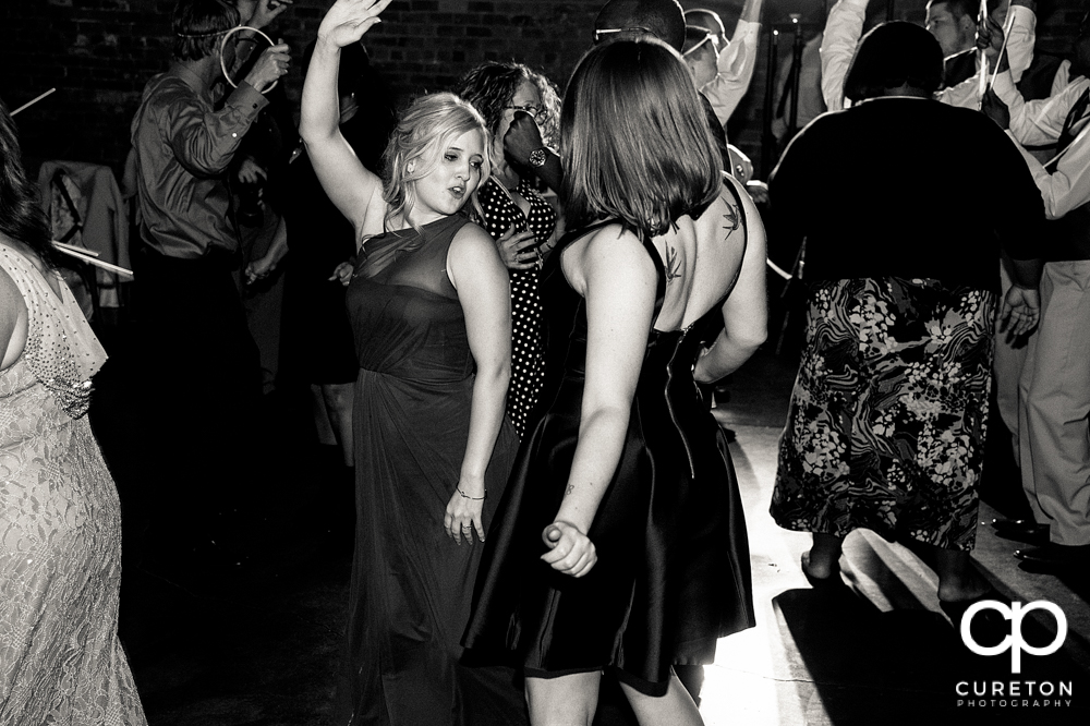 Wedding guests dancing to the sounds of Uptown Entertainment.