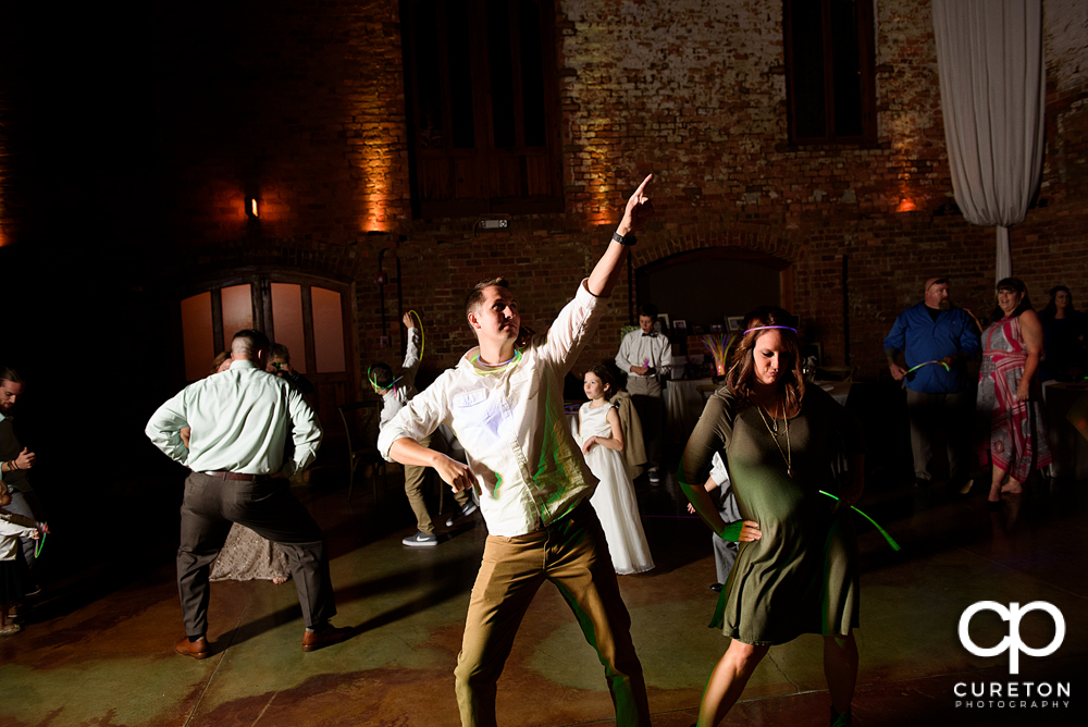 Wedding guests dancing.