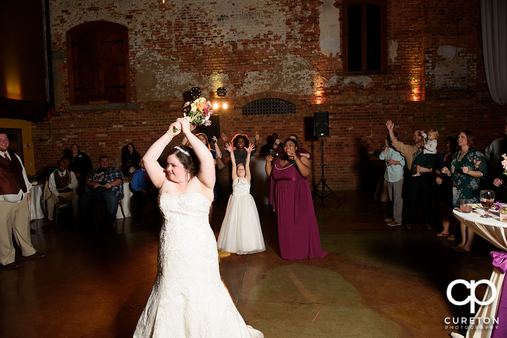 Bride tossing her bouquet.