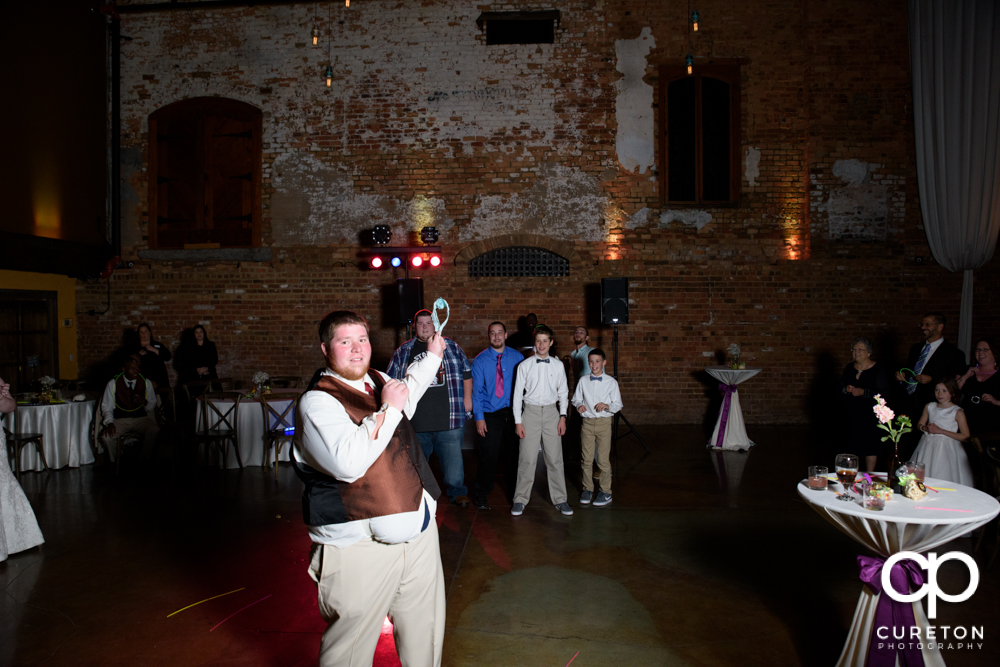 Groom tossing the garter.