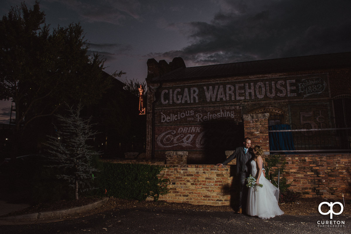 Bride and groom outside their wedding reception at The Old Cigar Warehouse.