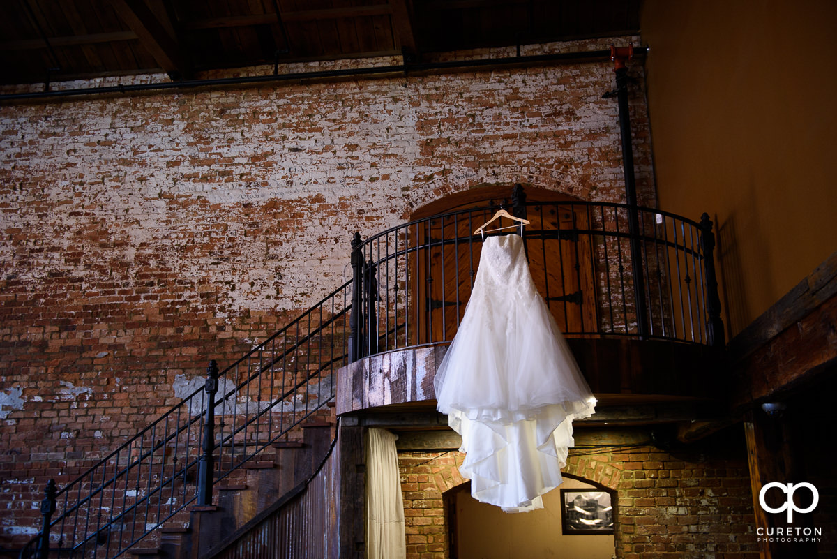 Bridal dress on the staircase at Old Cigar Warehouse.