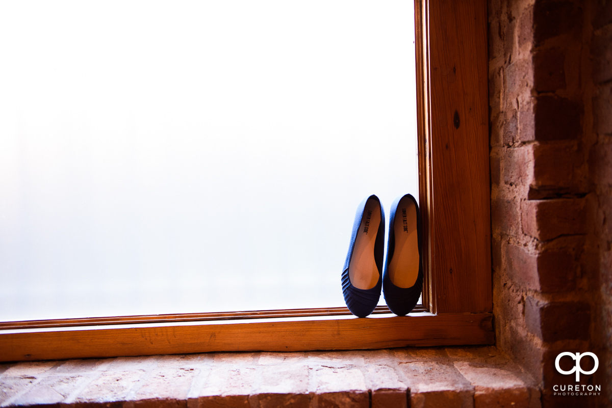Wedding shoes in a window at Old Cigar Warehouse.