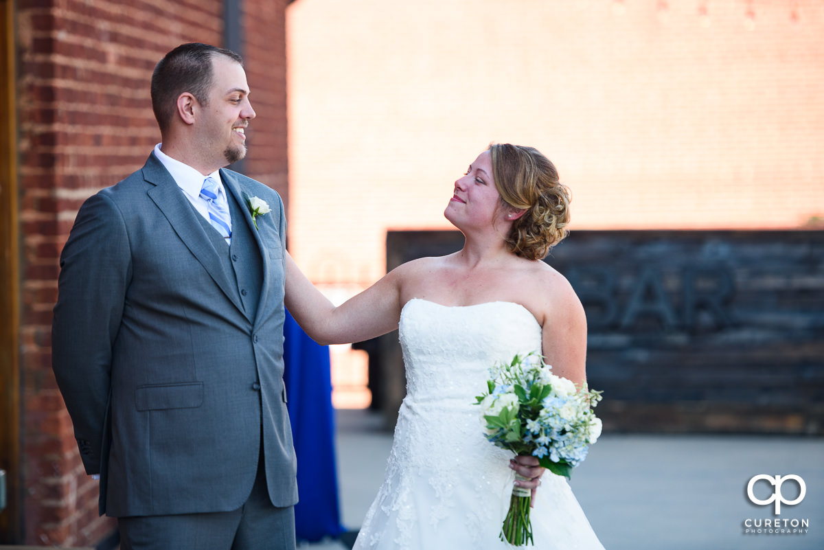 Bride and groom first look on the deck at Old Cigar Warehouse.