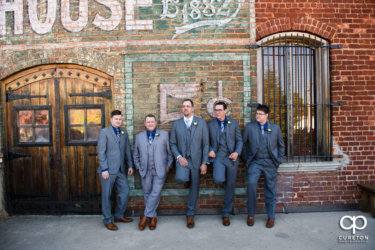 Groomsmen hanging out on the deck at The Old Cigar Warehouse.