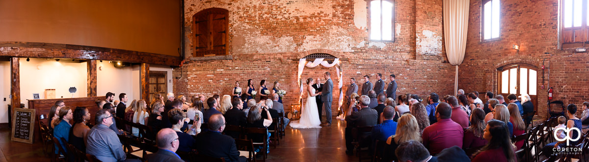Panoramic view of a wedding ceremony at The Old Cigar Warehouse in downtown Greenville,SC.