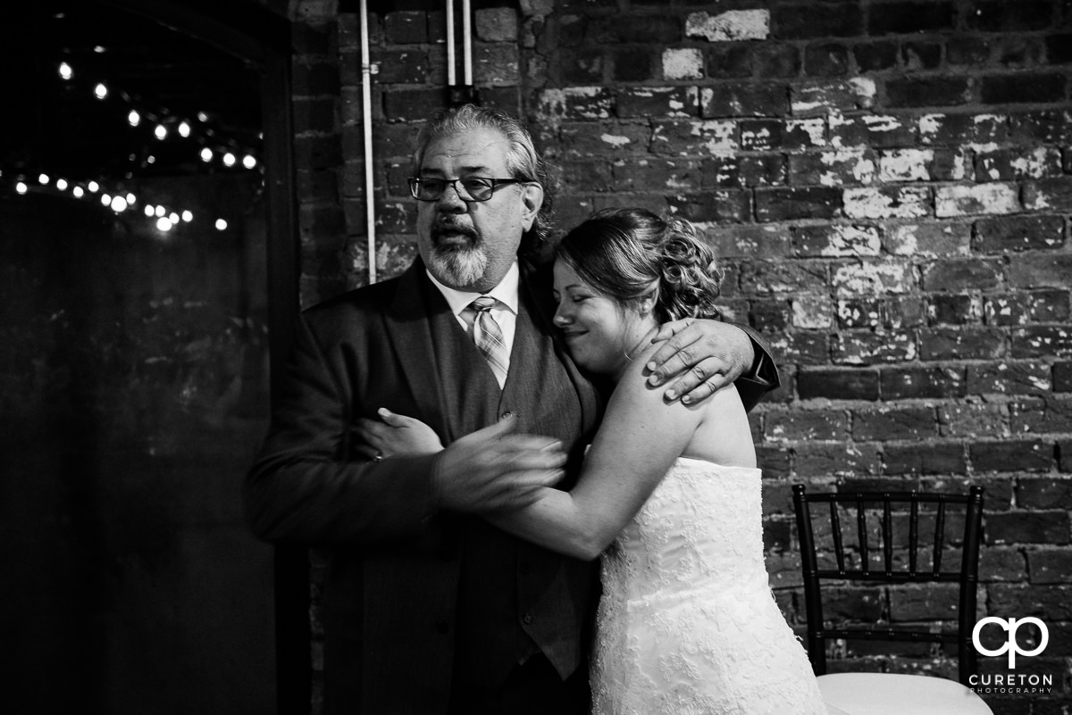 Groom's father and the bride.