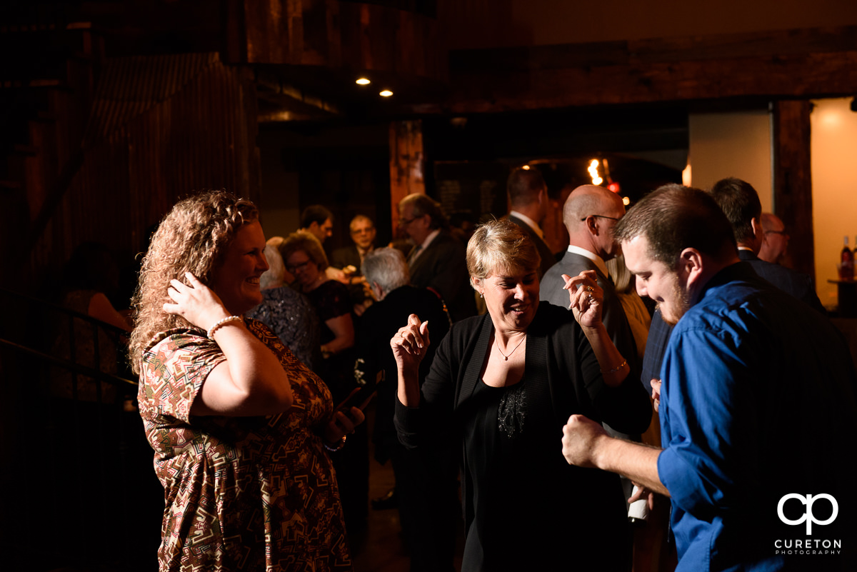 Guests dancing at the reception.