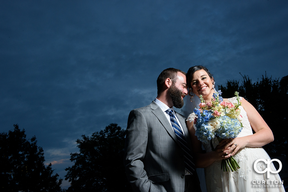 Bride and groom at sunset during their wedding reception at Old Cigar Warehouse.