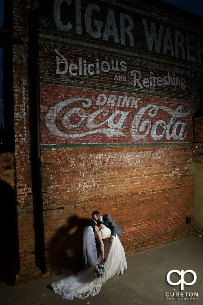 Bride and Groom dancing outside during their wedding reception at Old Cigar Warehouse.