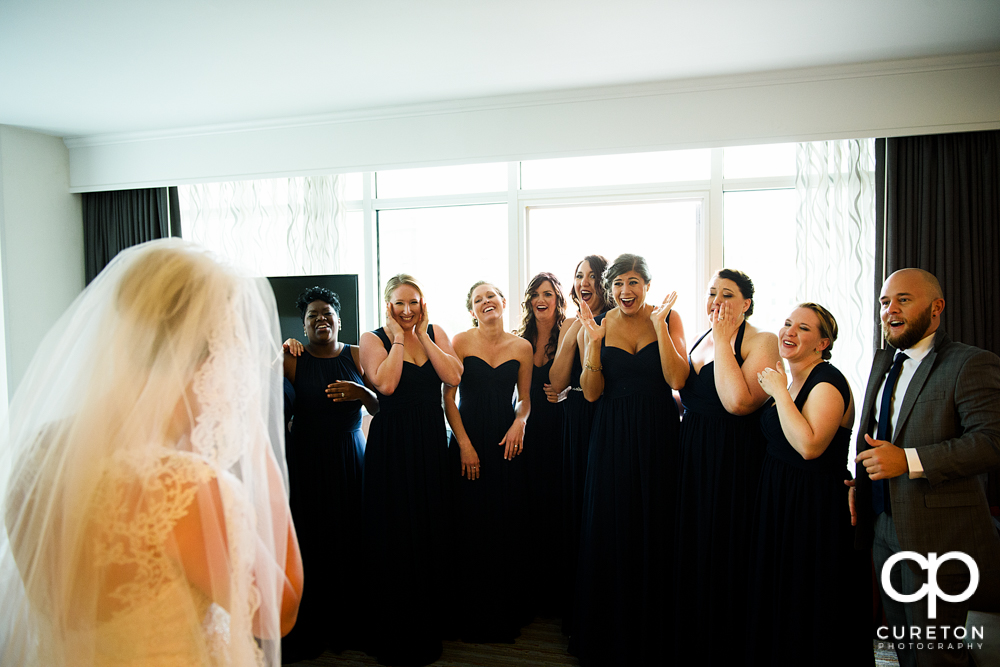 Bride reveal to the bridesmaids.