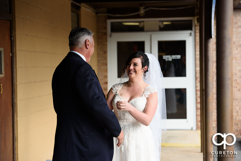 Bride and father first look.