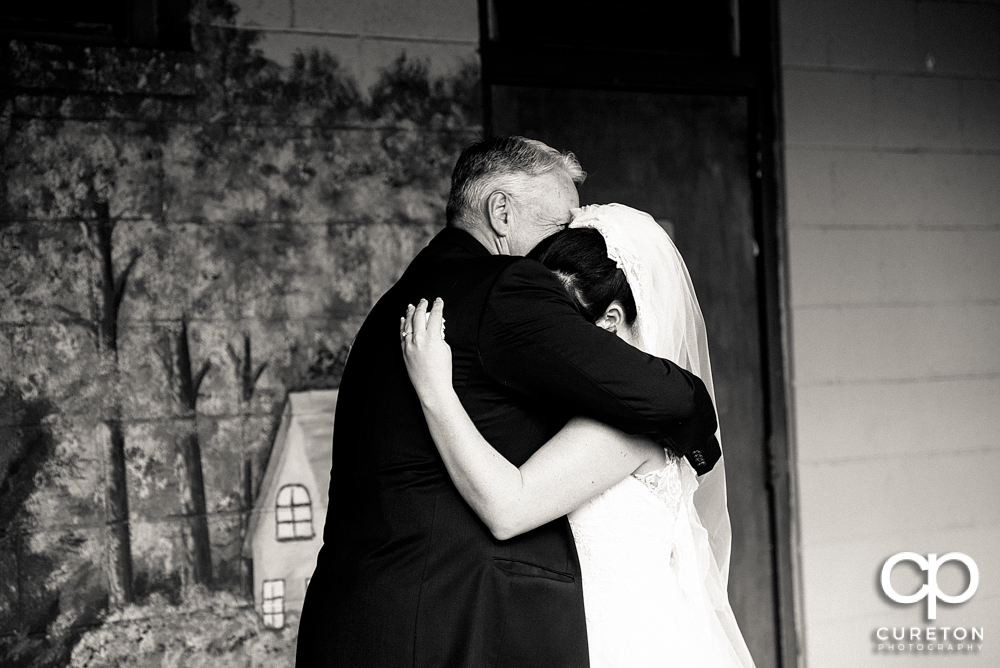 Bride and father first look.