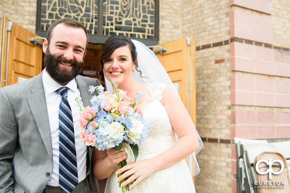Bride and groom outside the church at Saint Anthony's in downtown Greenville.