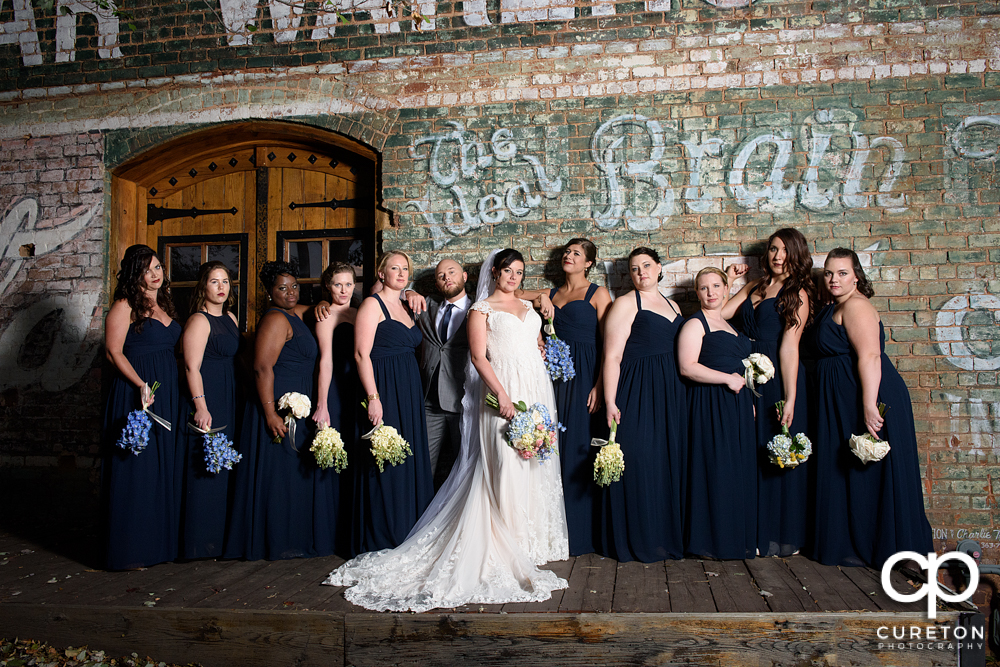 Bride and bridesmaids hitting the bridesmaids movie pose.