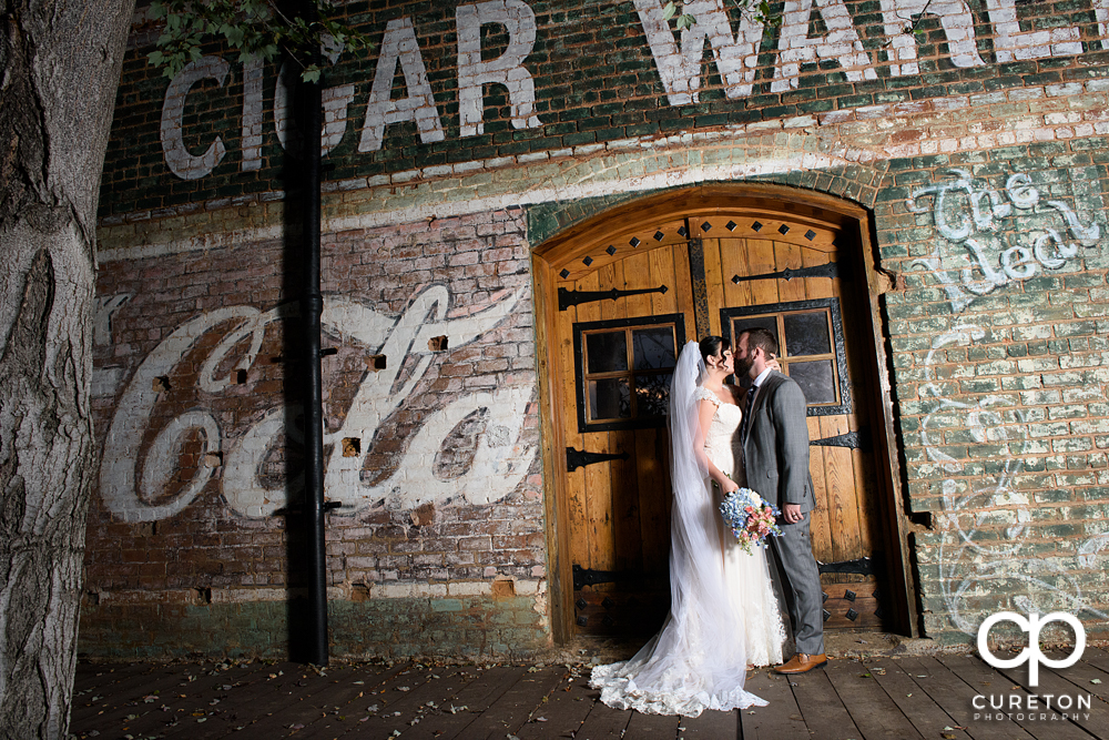 Bride and groom on the back deck of the old cigar warehouse.