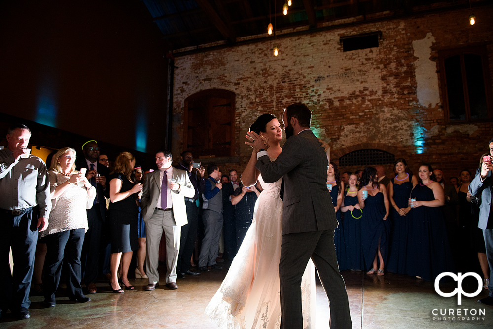 Bride and groom having a first dance.