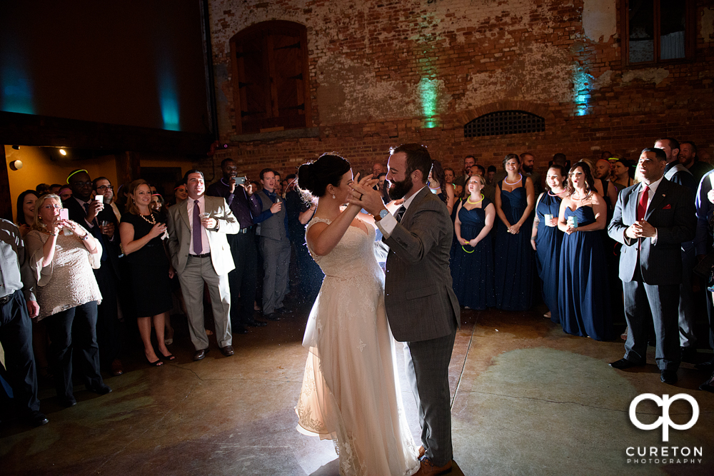 Bride and groom having a first dance.