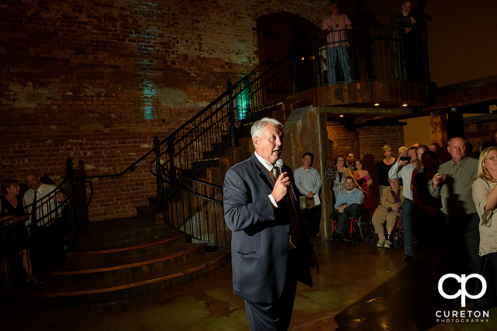 The father of the bride giving a toast.