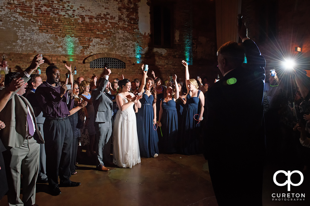 The father of the bride gives a toast at the old cigar warehouse.