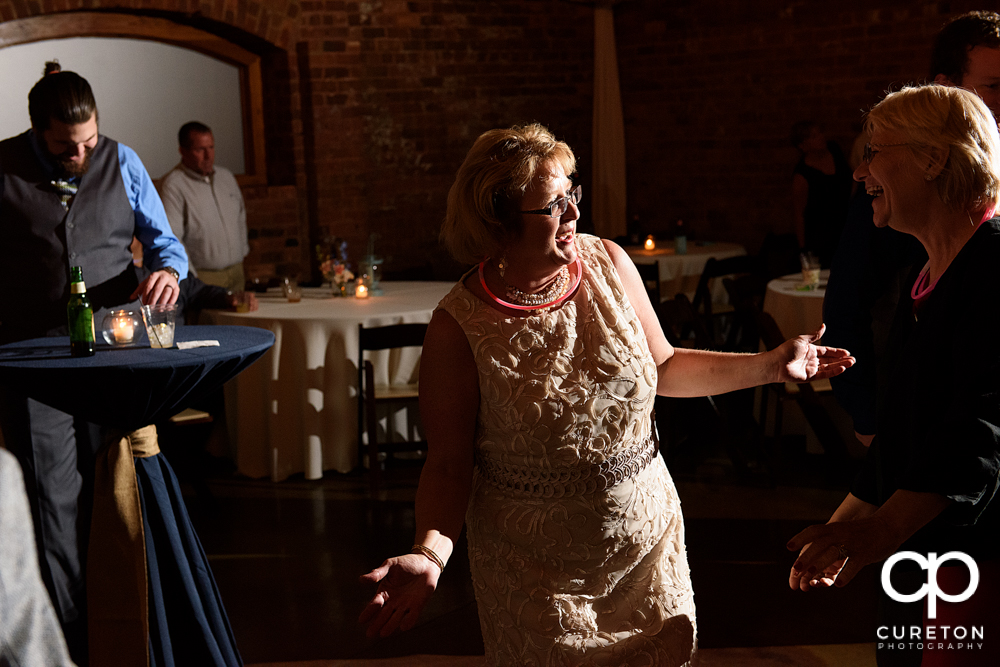 Guests dancing at the wedding reception.