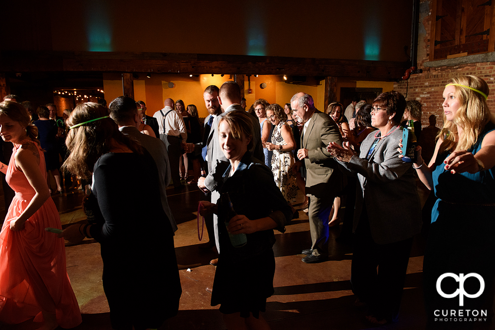 Guests dancing at the wedding reception.