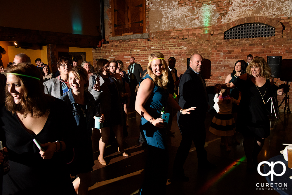 Guests dancing at the wedding reception.