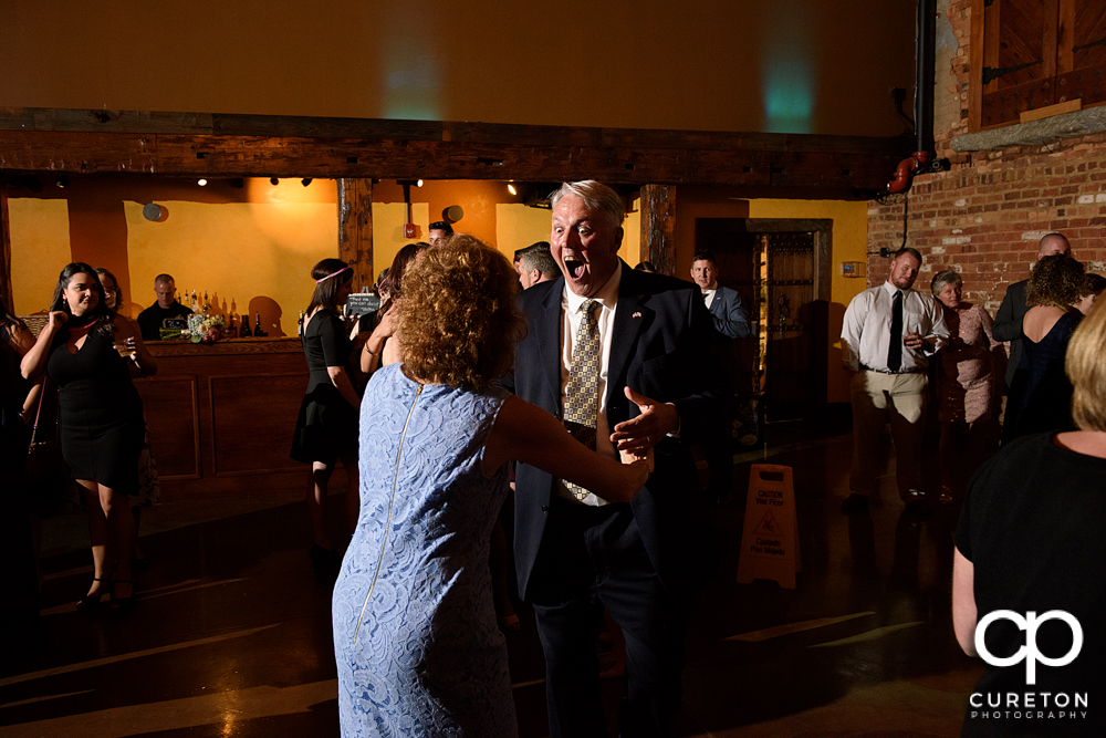 Guests dancing at the wedding reception.