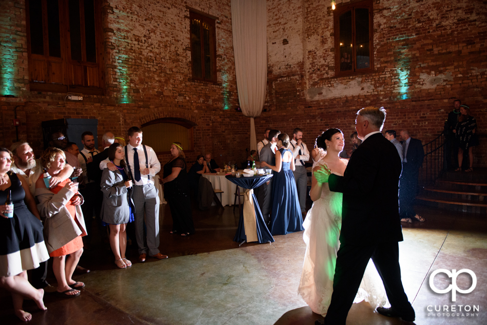 The bride and father dance.