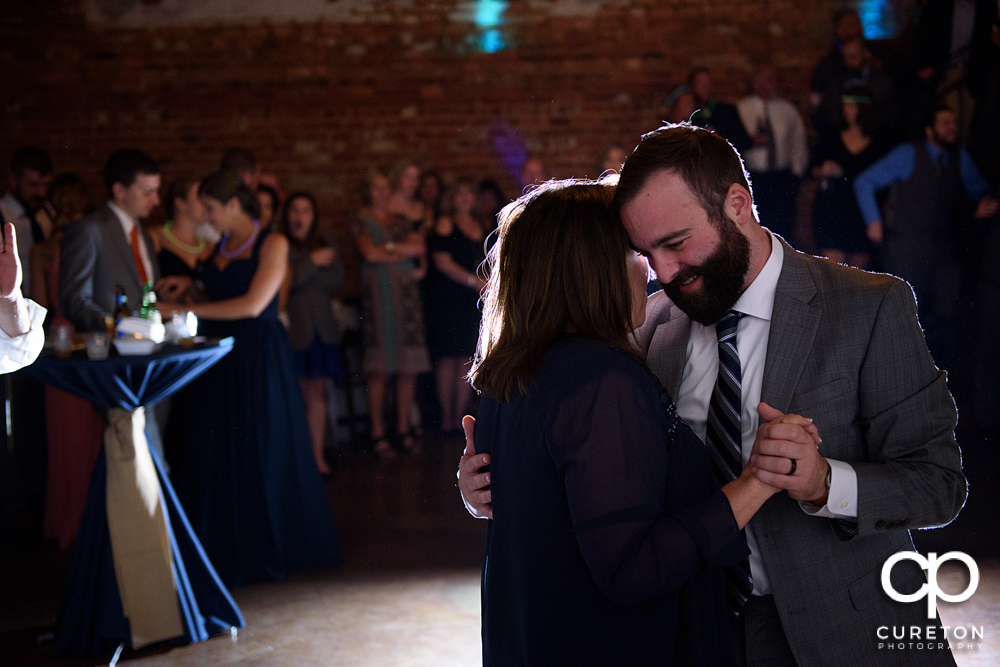 The groom dancing with his mother.