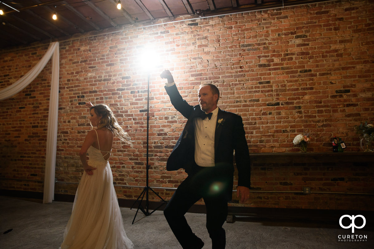 Bride and her father dancing.