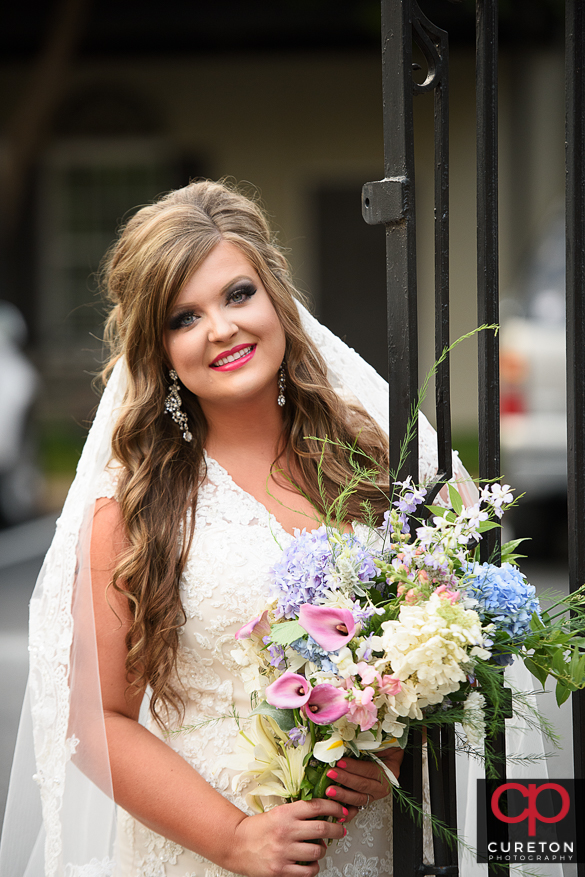 Bride with flowers downtown.