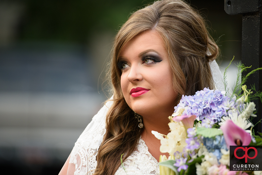 Bride with flowers downtown.