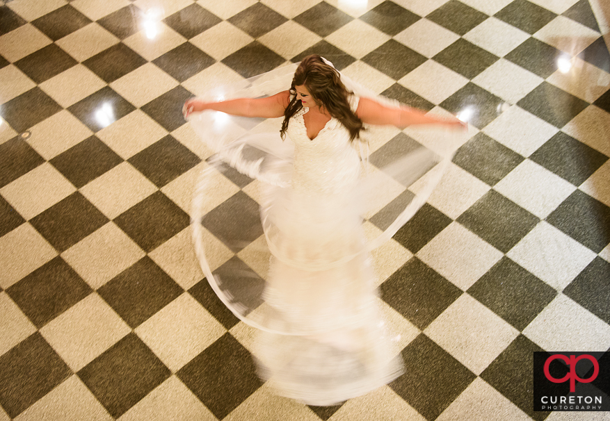 Bride spinning on the tile floors of the Poinsett hotel.