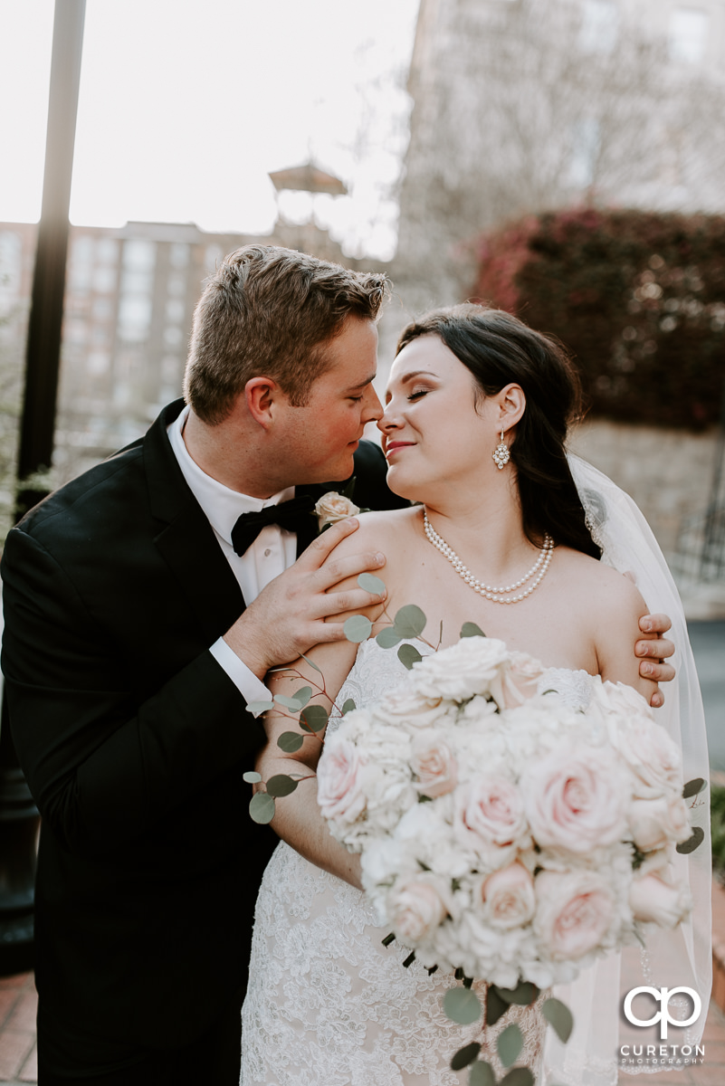 Bride and groom kissing after the ceremony.