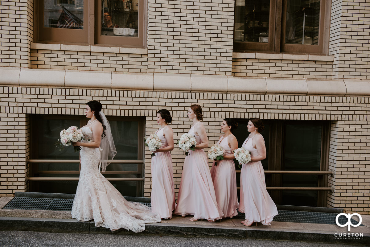Bride and her bridesmaids in the alley at the Westin Poinsett before the wedding ceremony.