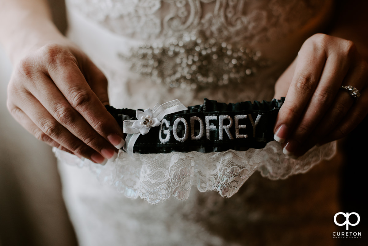 Bride holding the garter.