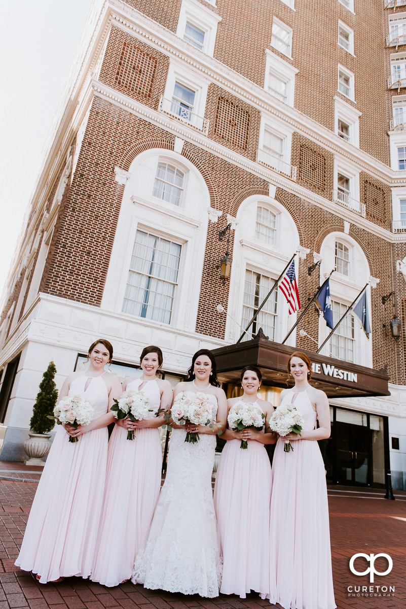 Bridesmaids in front of the hotel.
