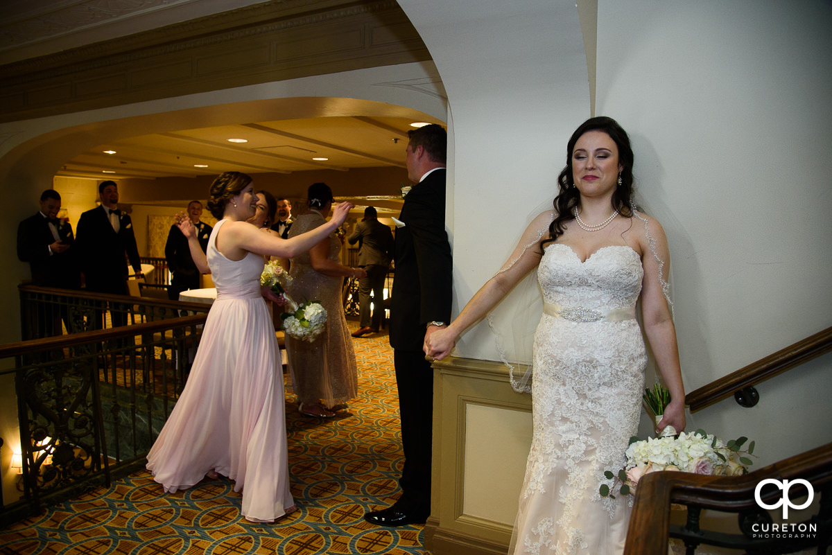 Bride smiling during the first touch.