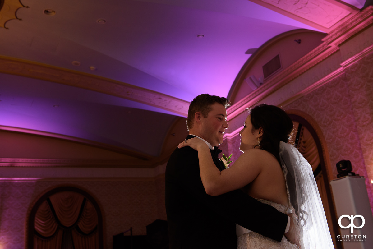 Bride and groom sharing a first dance.