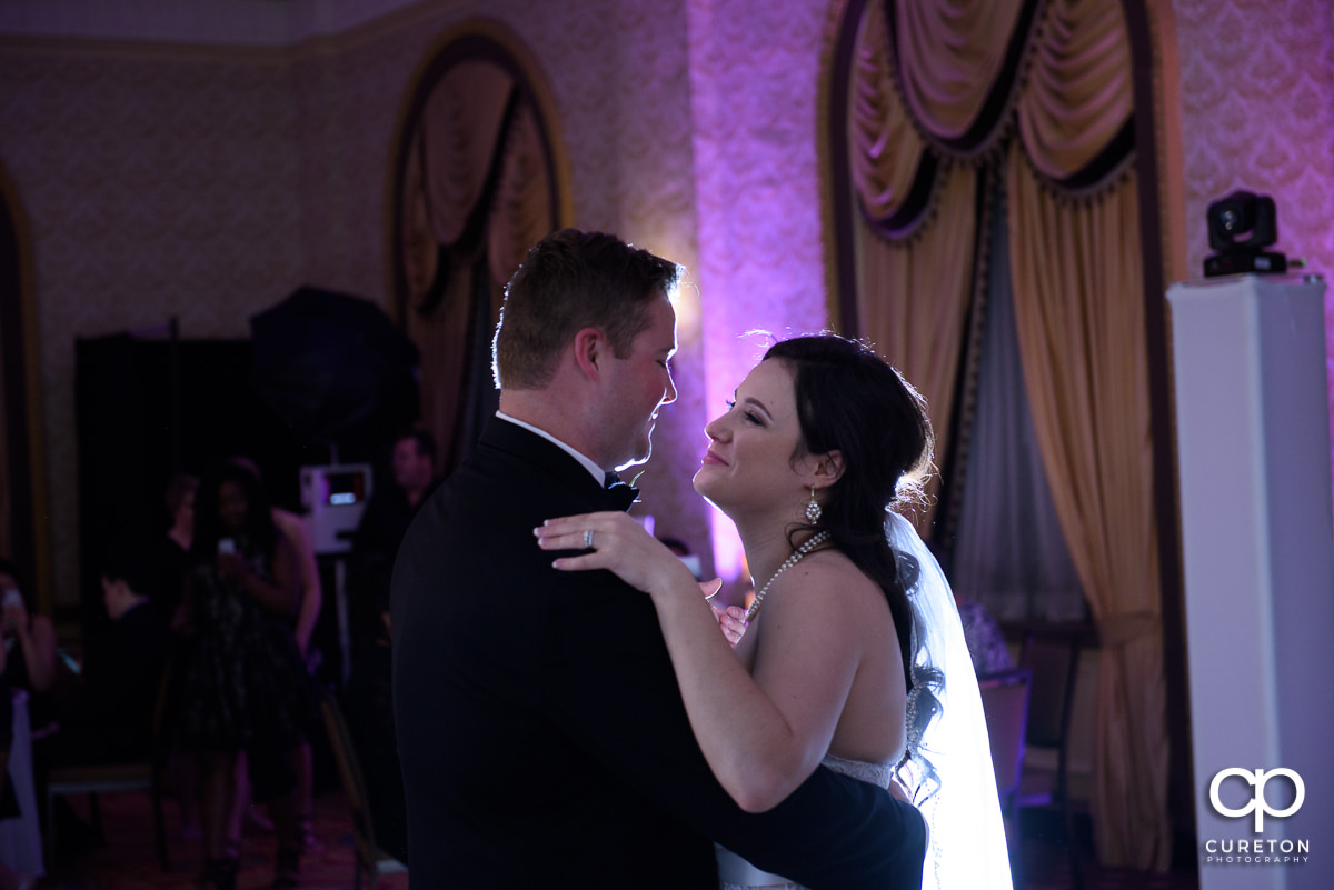 Bride and groom sharing a first dance at the reception.