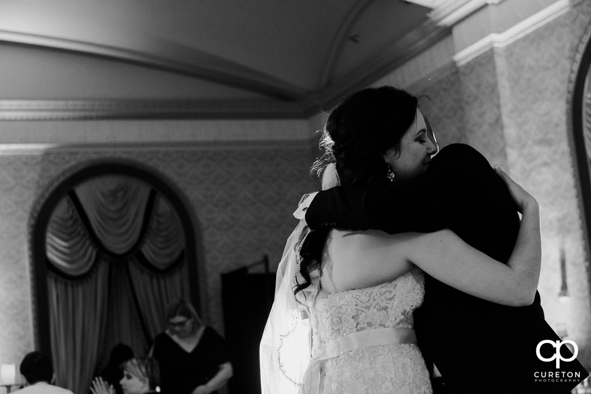Bride hugging her father during the reception.