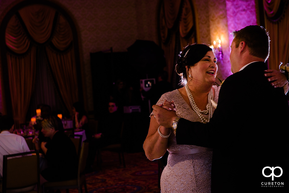 Groom dancing with his mother during the reception.