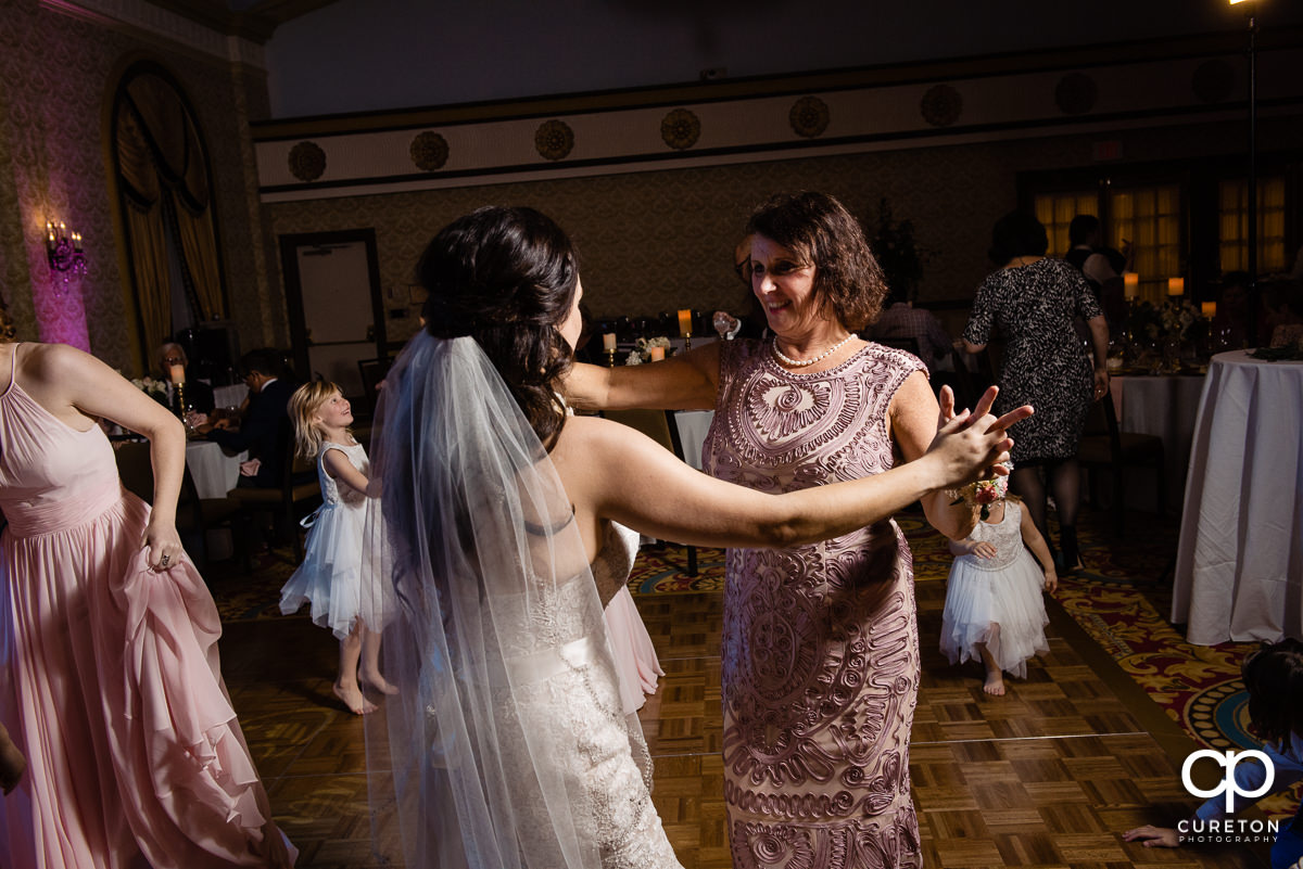 Bride dancing with her mother at the wedding reception.
