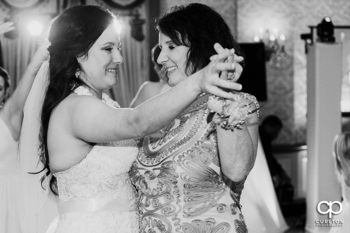 Bride dancing with her mother at the wedding reception.