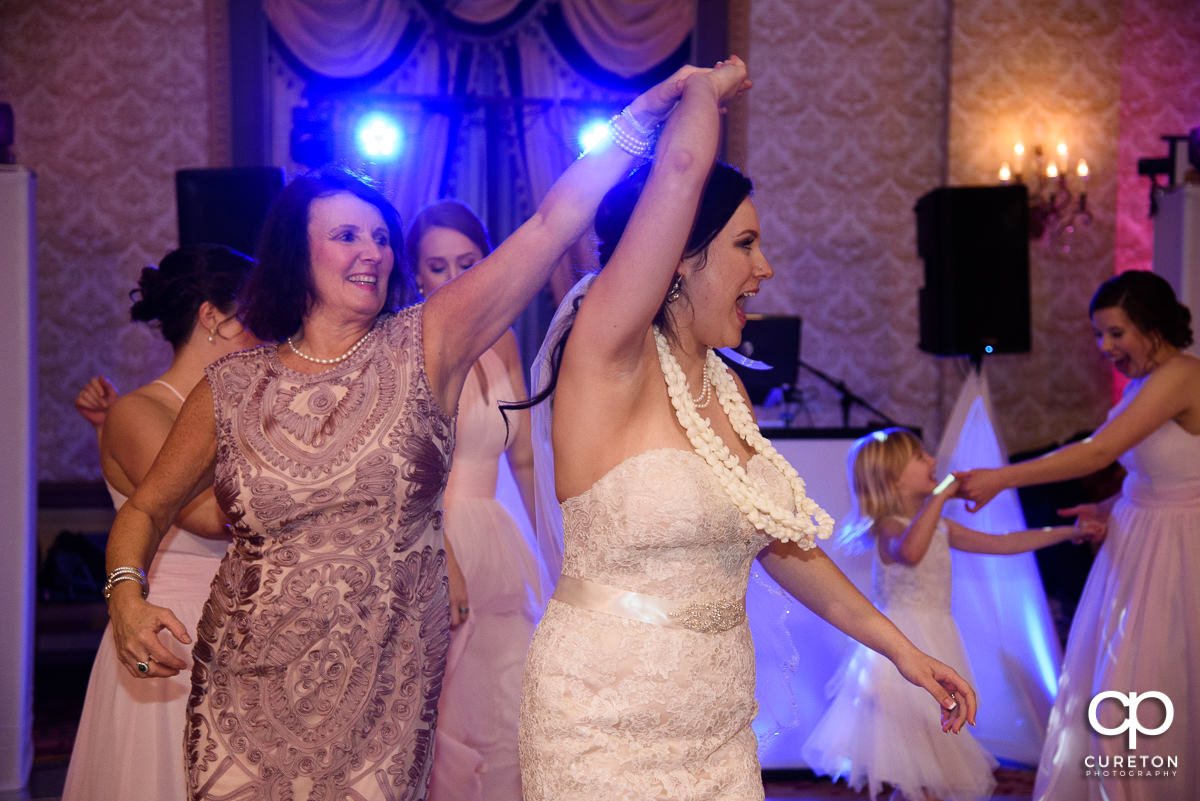 Bride dancing with her mother at the wedding reception.