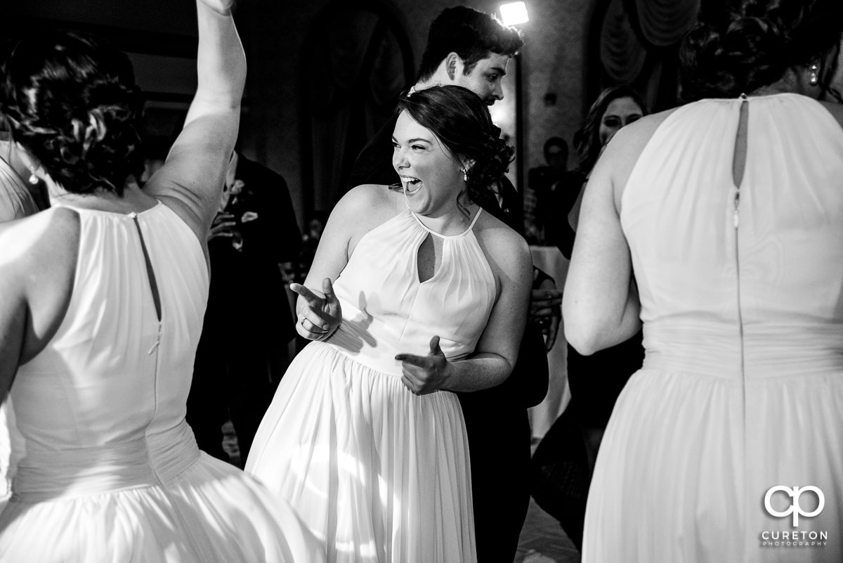 Wedding guests dance the night away at the wedding reception.