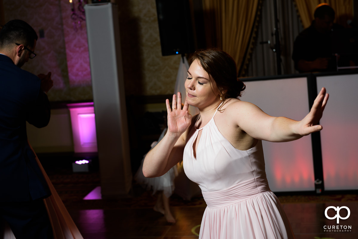 Bridesmaid dancing.