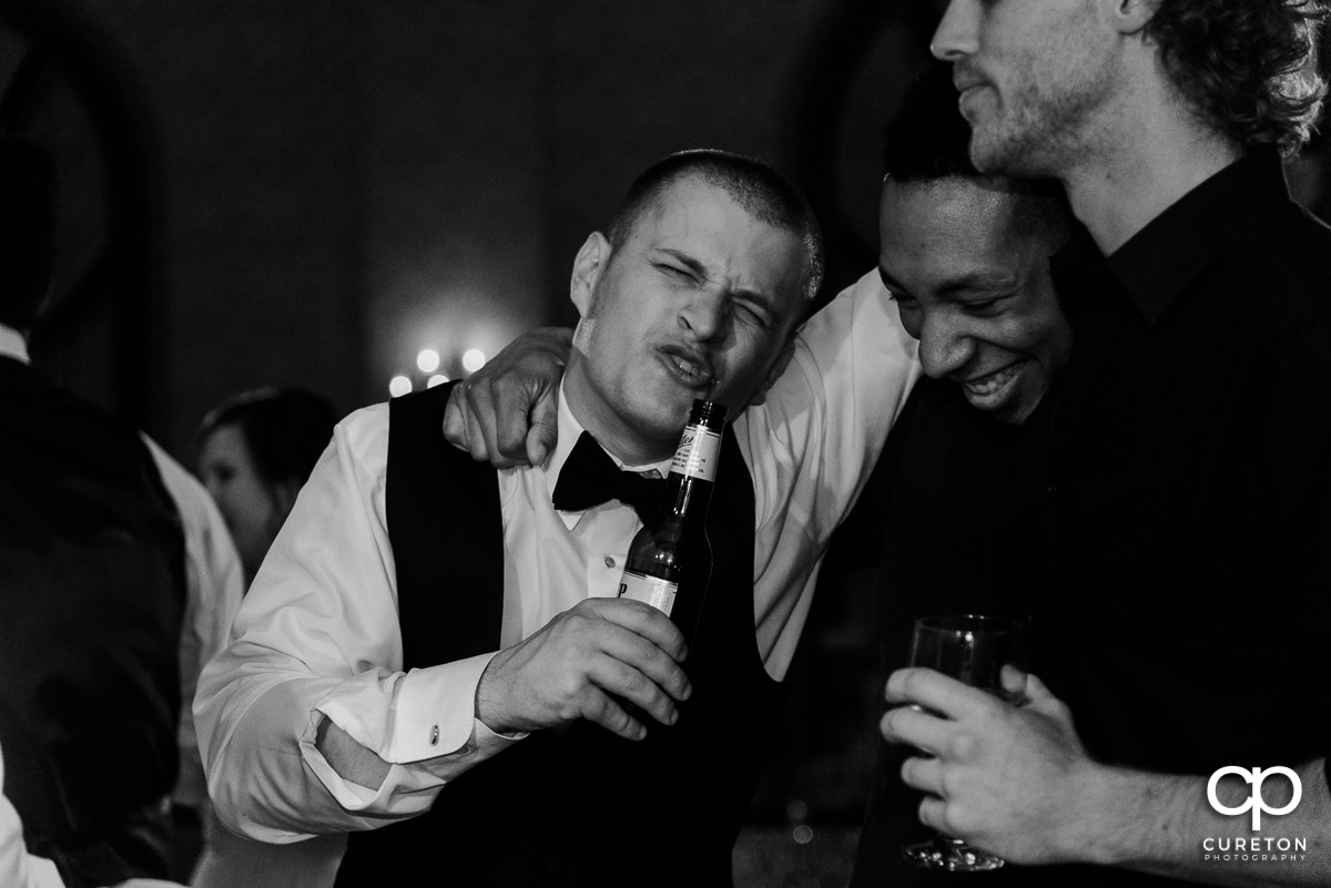 Groomsmen singing.